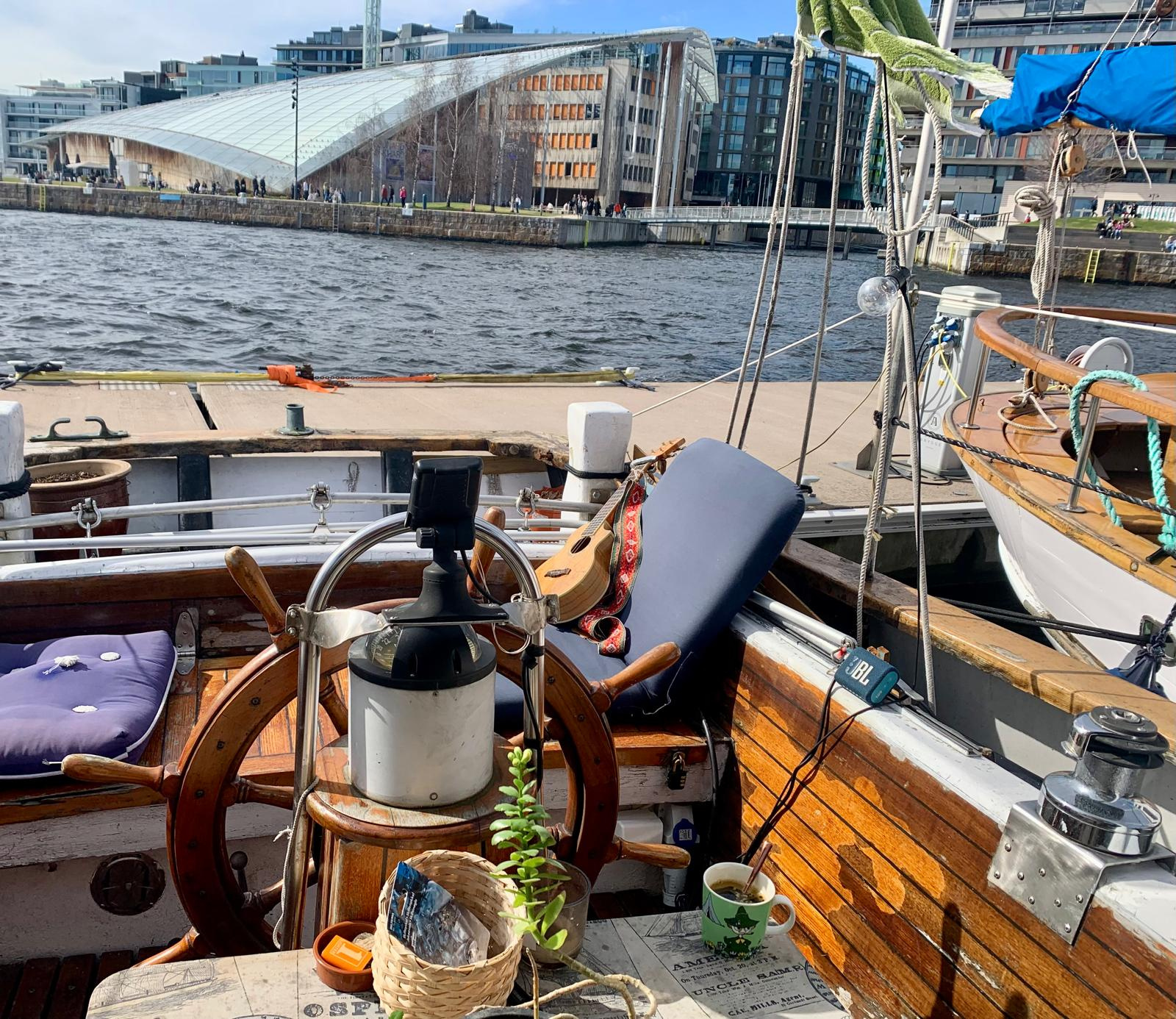 Guitar on the deck of Tingeling with Astrup Fearnley museum in background